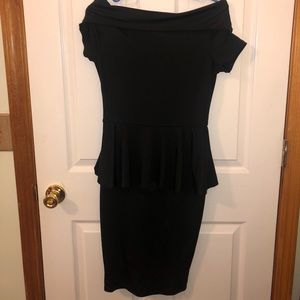 Off shoulder black dress with peplum waist.